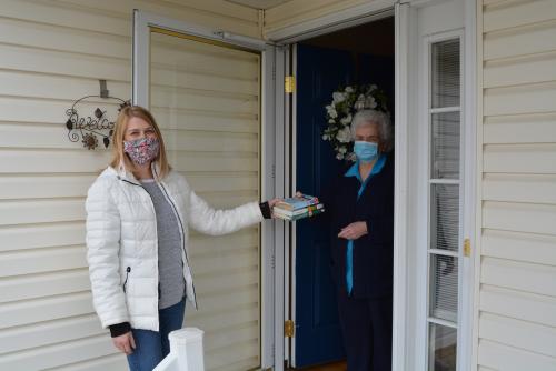 Christina Patient delivers Library materials to Laverna Baier, a Homebound Delivery patron.