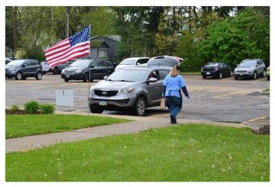 Stephanie delivers items via curbside service